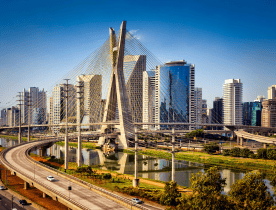 Aerial view of Recife, Brazil, featuring its coastline and urban skyline.