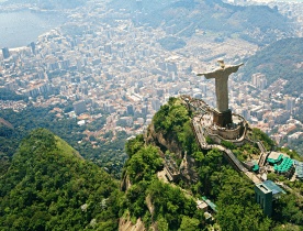 Coastal view of Vitória, Brazil, displaying beaches, bridges, and cityscape.