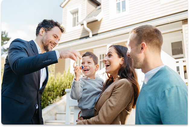 Family getting their keys from real estate agent